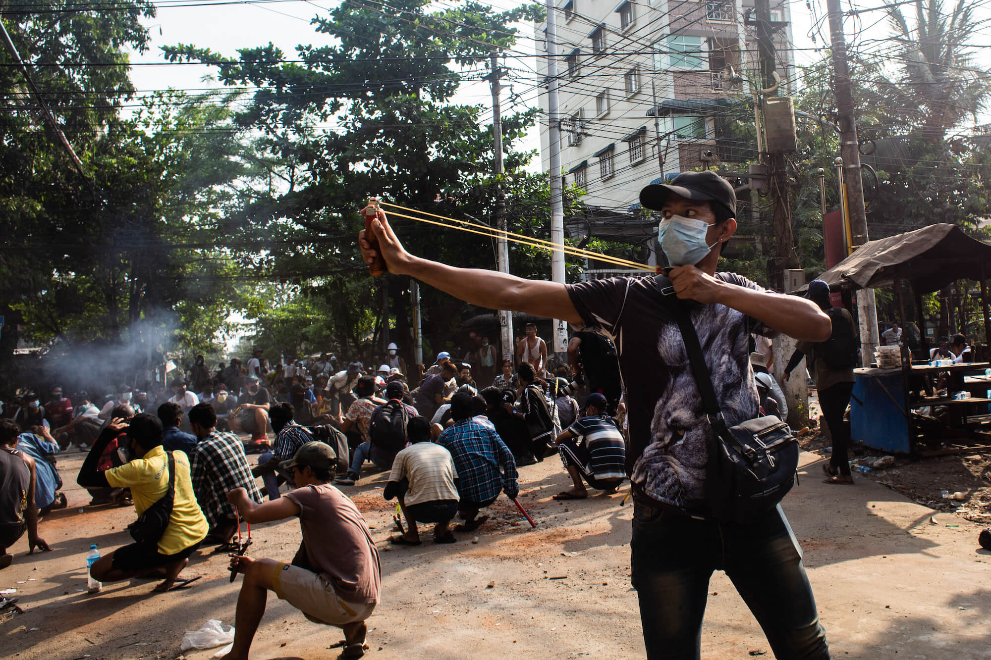 Protesters attempt to resist an assault by security forces in Thaketa Township, Yangon, 28 March 2021